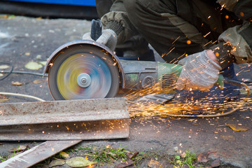 Angle grinder. Construction work with the help of angle grinder.