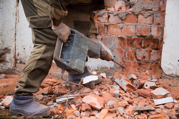 Jackhammer. The use of a jackhammer in construction works.