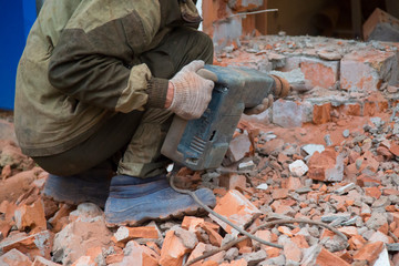 Jackhammer. The use of a jackhammer in construction works.