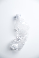 Smashed Plastic Water Bottle on White Background