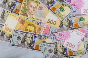 Money dollars and hryvnia, close-up top view concept finance