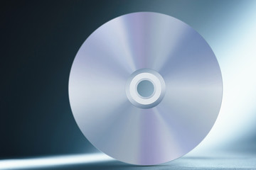 Compact disc on abstract blue background