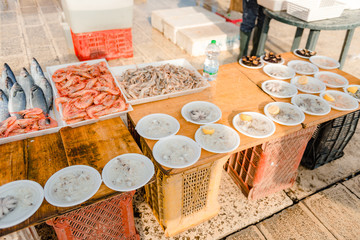 Freshly caught fish, sea urchin, oyster, cuttlefish, octopus on the market on the pier of St....