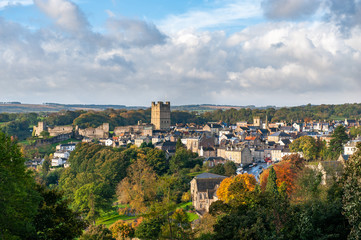 Fototapeta na wymiar View of Richmond Castle, North Yorkshire with the town in the foreground and autumn colors