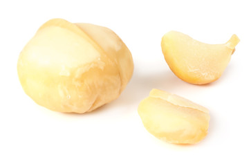 Macadamia nut with pieces isolated on a white background
