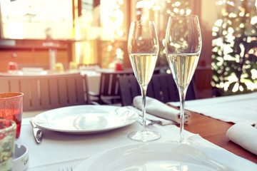 two glasses of tasty white wine at a restaurant
