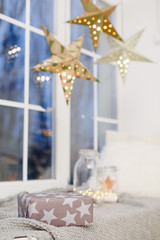 Arch window in a room decorated for celebrating Christmas. Luxury interior in white colors. Frozen mirror