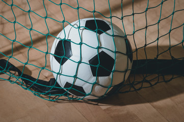 Football futsal ball goal and floor. Indoor soccer sports hall.