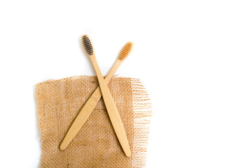 Bamboo tooth brush on white background