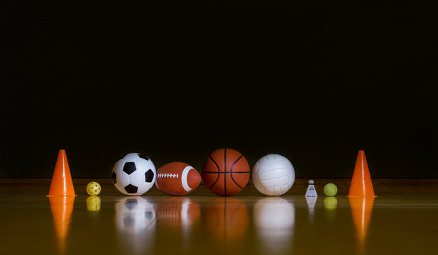 Close-up Of Various Sport Equipments Isolated On Black Background