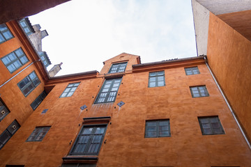 Fototapeta na wymiar Courtyard of an old orange house in Copenhagen, Denmark