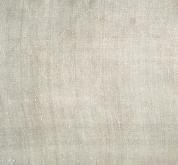 Fototapeta na wymiar fragment of a very old linen homespun fabric