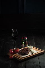 Fototapeta na wymiar Meat steak on a wooden board. catering menu