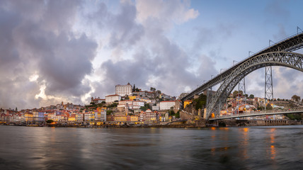 Fototapeta na wymiar City of Porto at sunset, as seen from Cais de Gaia over Douro River