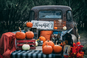 old vintage classic GMC truck with pumpkins and fall colors - obrazy, fototapety, plakaty