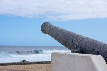 Old canon replica overseaing the sea at Saint pierre harbor Réunion island