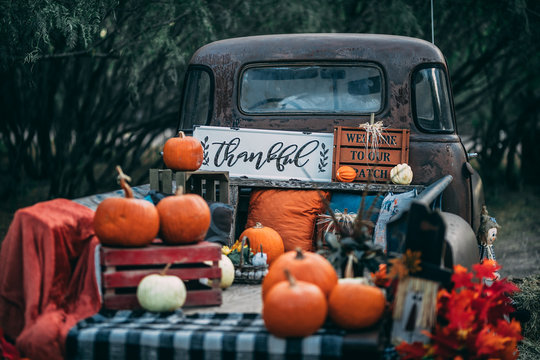 old vintage classic GMC truck with pumpkins and fall colors