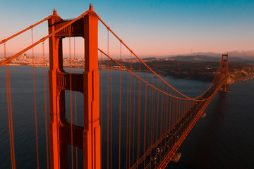 Beautiful aerial San Francisco view at early morning sunrise with Golden gate bridge and downtown.
