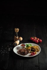 Meat medallion and french fries . catering menu