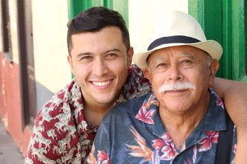 Hispanic senior man with his son