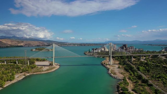 Aerial drone video of new famous public strait cable bridge of Halkida or Chalkida connecting mainland with Evoia island, Greece
