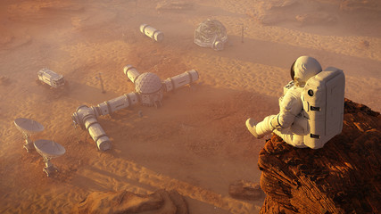 astronaut on planet Mars, sitting on a cliff above a research station © dottedyeti
