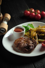 Meat medallion and french fries . catering menu