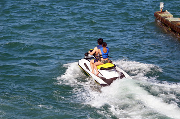 Tandem jetski riders off Miami Beach,Florida