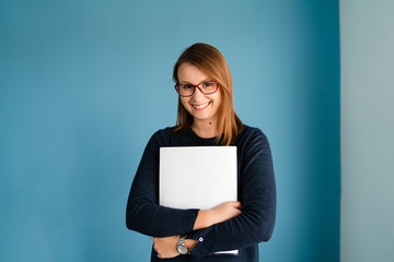 Portrait of young business woman with glasses secretary holding file folder job application in...