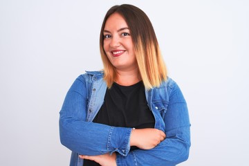 Obraz premium Young beautiful woman wearing denim shirt standing over isolated white background happy face smiling with crossed arms looking at the camera. Positive person.