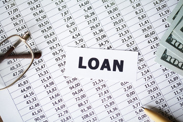 Credit concept. Loan written on white card.