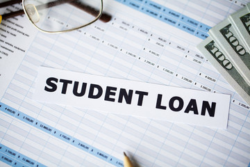 Obraz premium Credit concept. Student loan written on white card.
