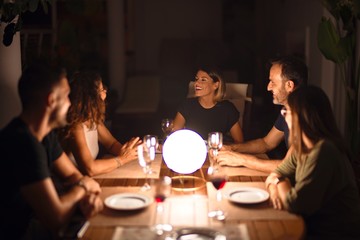 Beautiful family on dinner talking and smiling at terrace