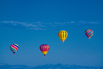 Colorful hot air balloons in mid air