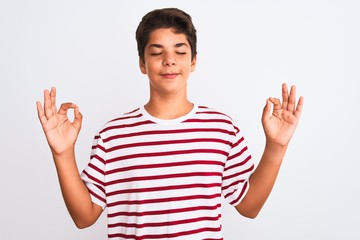 Handsome teenager boy standing over white isolated background relax and smiling with eyes closed...