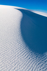 Closeup of the white sand dune showing a grainy sand texture