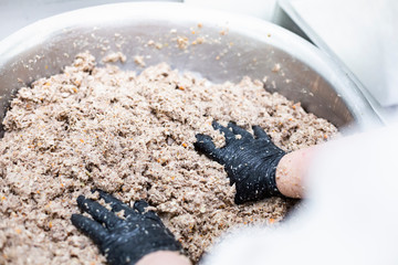Food production. The cook prepares stuffing for dumplings