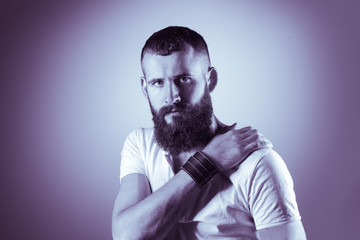 Portrait of handsome man standing, isolated on grey background