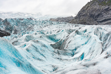 Tourists visit the Nigardsbreen Glacier, an arm of the Jostedalsbreen glacier, Jostedalsbreen National Park.