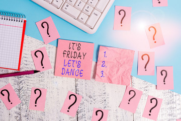 Handwriting text It S Friday Let S Dance. Conceptual photo Celebrate starting the weekend Go party Disco Music Writing tools, computer stuff and math book sheet on top of wooden table