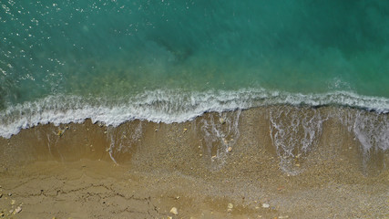 Aerial top down photo of tropical sandy beach with turquoise clear sea