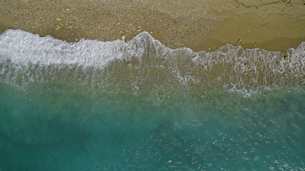 Aerial top down photo of tropical sandy beach with turquoise clear sea