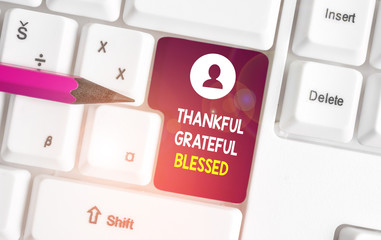 Conceptual hand writing showing Thankful Grateful Blessed. Concept meaning Appreciation gratitude good mood attitude White pc keyboard with note paper above the white background