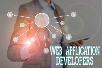 Conceptual hand writing showing Web Application Developers. Concept meaning Internet programming experts Technology software Woman wear work suit presenting presentation using smart device