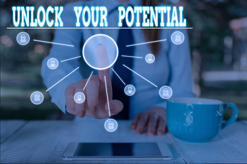 Word writing text Unlock Your Potential. Business photo showcasing improve self awareness Skills to Achieve more Woman wear formal work suit presenting presentation using smart device