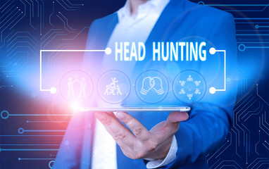 Text sign showing Head Hunting. Business photo text process of recruitment of a prospective or potential employee Male human wear formal work suit presenting presentation using smart device