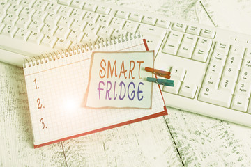 Conceptual hand writing showing Smart Fridge. Concept meaning programmed to sense what kinds of products being stored inside notebook reminder clothespin with pinned sheet light wooden