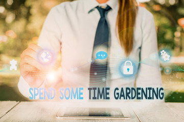 Conceptual hand writing showing Spend Some Time Gardening. Concept meaning Relax planting flowers...