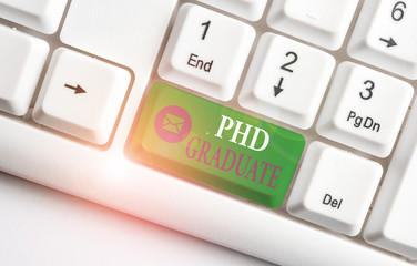 Word writing text Phd Graduate. Business photo showcasing highest university degree that is...