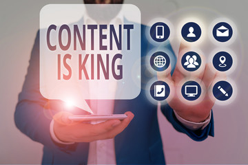 Conceptual hand writing showing Content Is King. Concept meaning believe that content is central to...